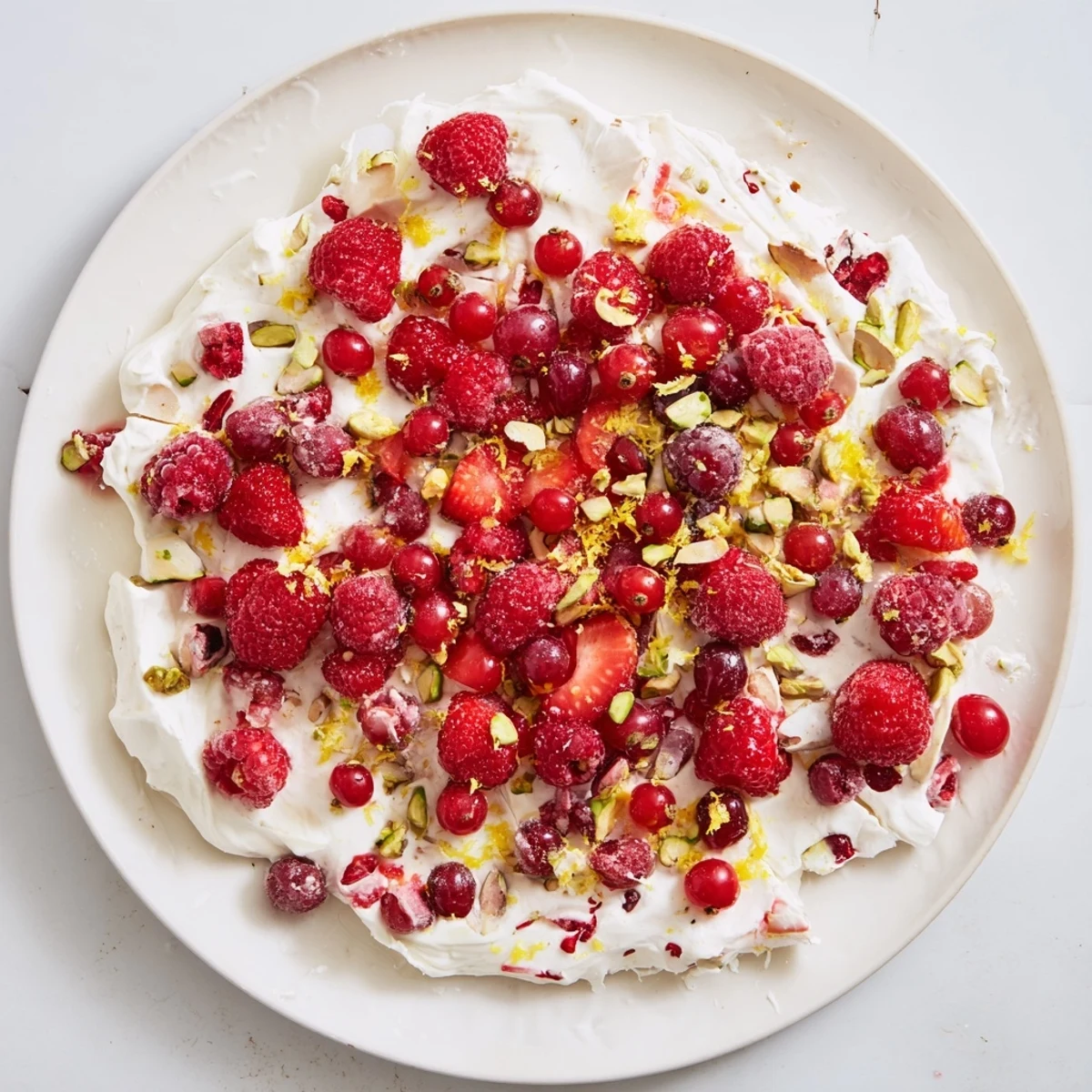 Picture a colorful Frozen Yogurt Bark; sweet red berries scattered across a frozen yogurt base.