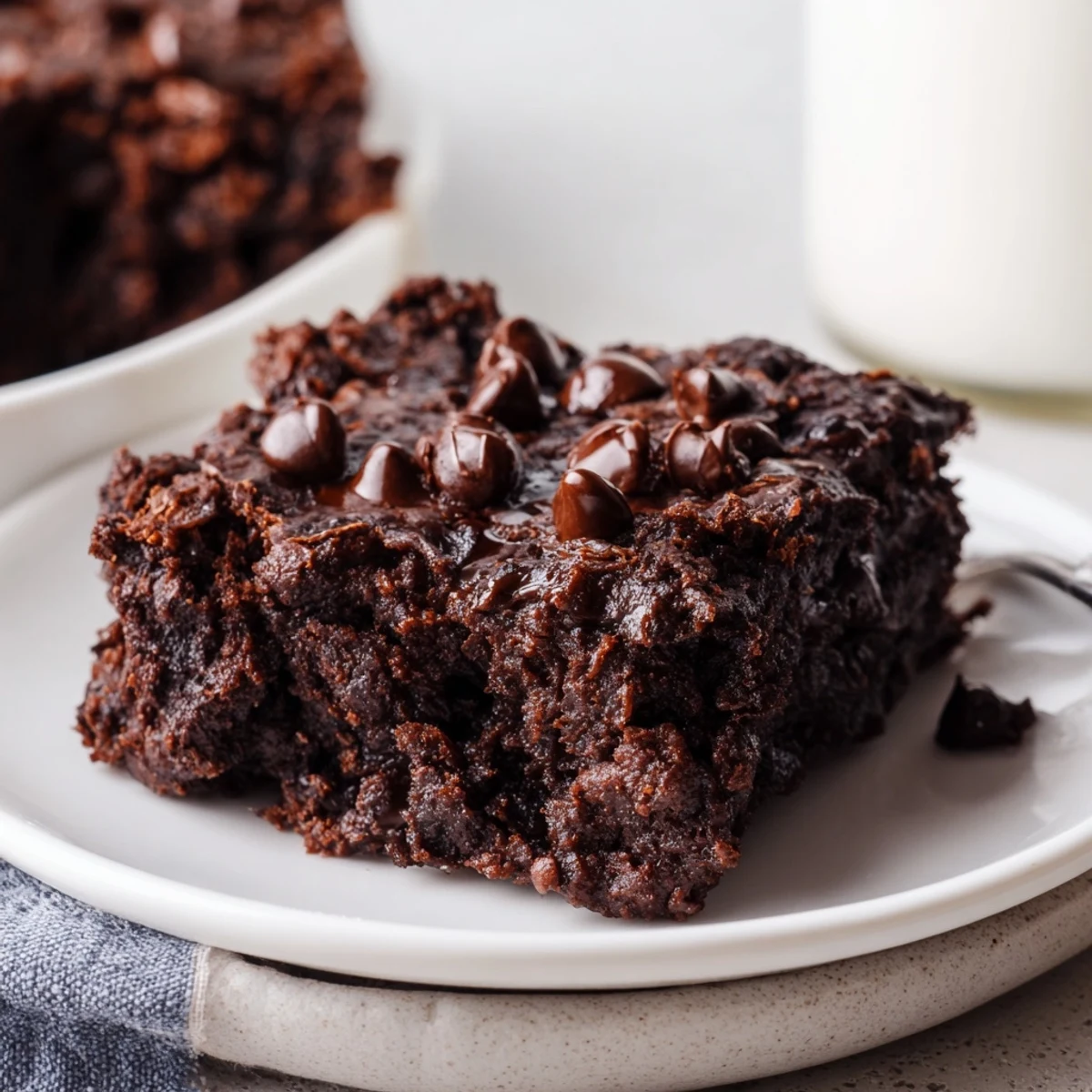 Warm and decadent Greek yogurt brownies, perfectly baked with a soft, moist center and chocolatey aroma.