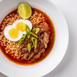 Vibrant Chaos Cooking Birria Ramen bowls with soft-boiled eggs, scallions, cilantro, and tender beef.