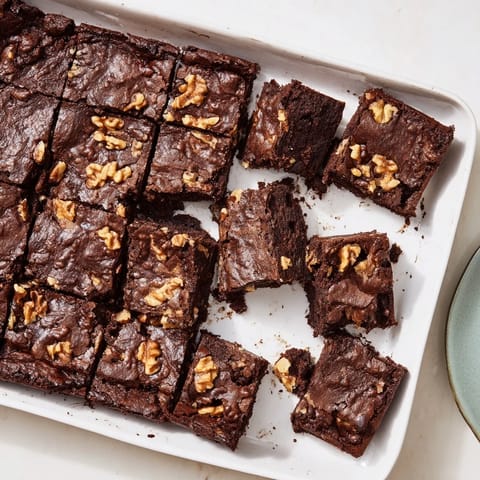 Warm fudgy walnut brownies: Enjoy these chocolatey and rich treats fresh from the oven, served with coffee.