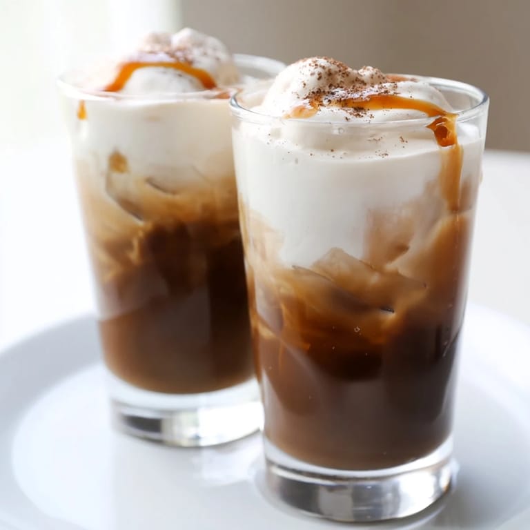 Delectable brown sugar Dalgona latte topped with cinnamon, a visually stunning coffee treat.