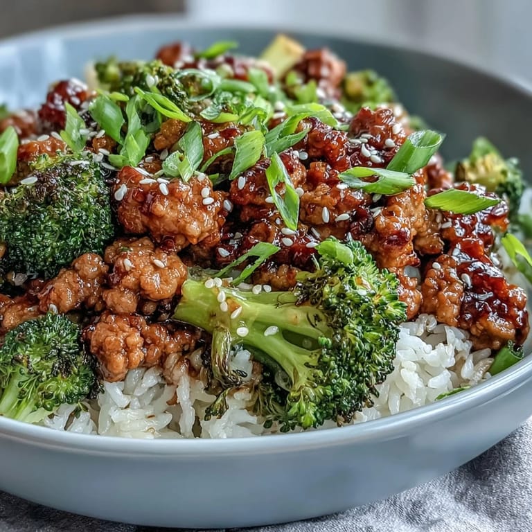 Dairy-free sweet and spicy turkey broccoli bowls topped with sesame seeds and green onion, ready to serve for dinner.